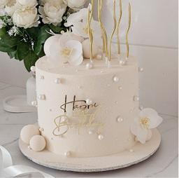 White cake decorated with pearl detailing